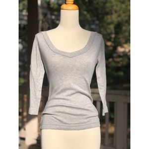 A grey v-neck tee.